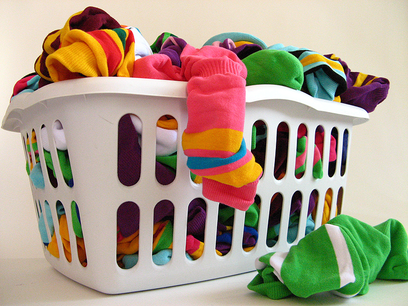 Colorful socks in a laundry basket